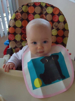 Maja loves to eat breakfast in her new bib!